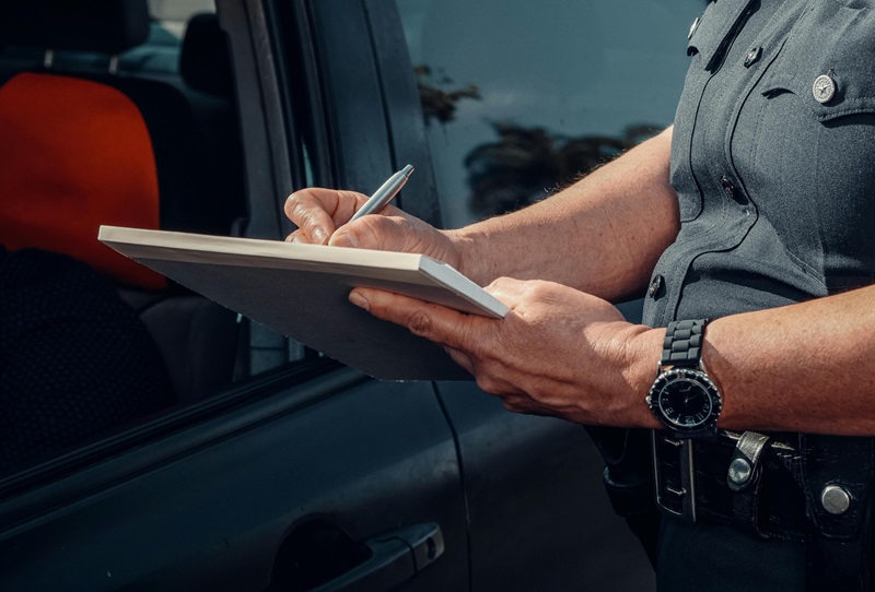 police-officer-writing-on-a-notebook